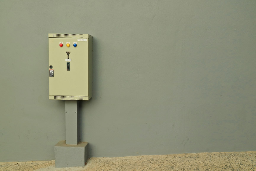 Outdoor electrical switchboard controls on the wall. Technology and safety concept.