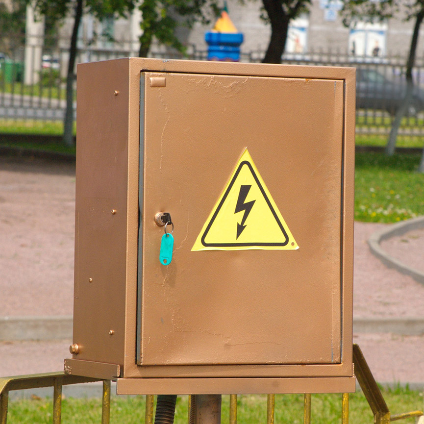 Brown electrical cabinet with Caution, high voltage sign